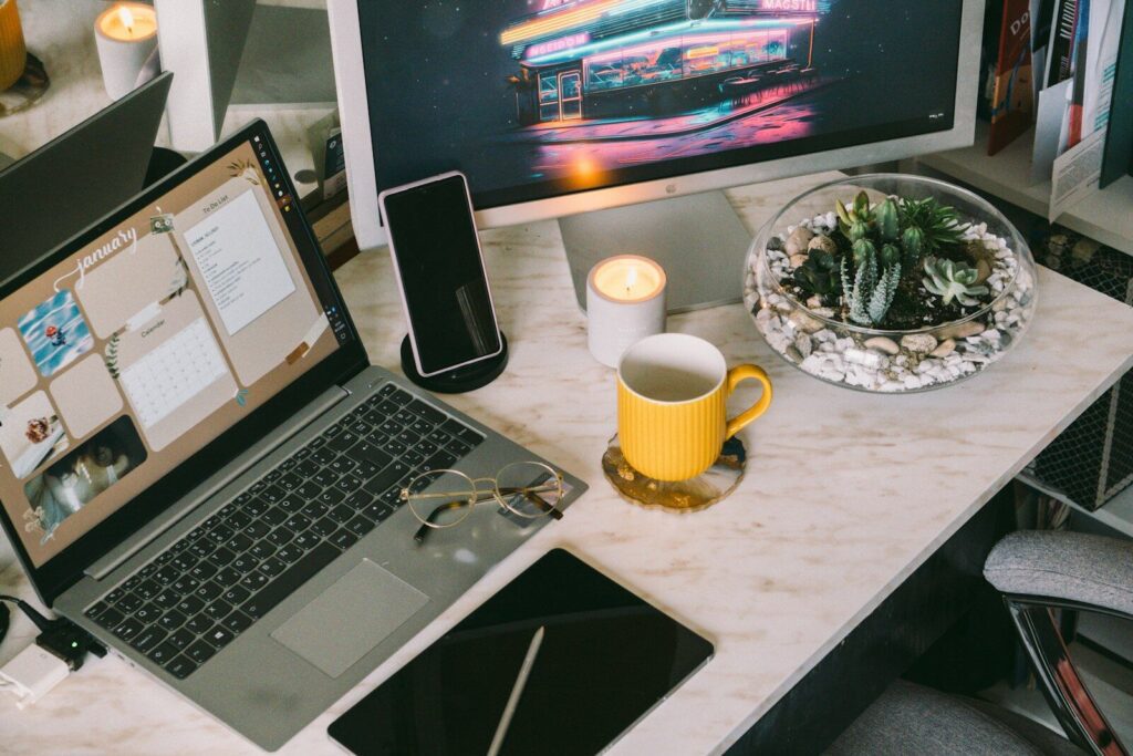 a laptop computer sitting on top of a desk