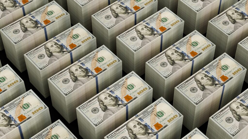 Stacks of hundred dollar bills are shown.